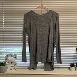Grey long sleeve sweater with a tie back.